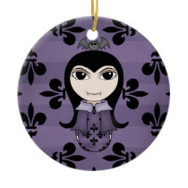 Cute gothic vampire girl in purple christmas tree ornaments