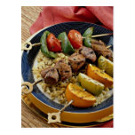 Delicious Vegetable, beef and fruit kabobs over ri Postcards