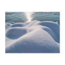 Detail of frozen river bank,ice,stone,sand,water.. post card