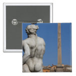 Detail of the back of a male nude statue on the pinback buttons