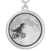 Dinosaur on a bike moon pendant