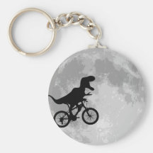 Dinosaure sur un vélo en ciel avec la lune porte-clefs