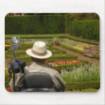Disabled man in wheelchair in garden mousepads