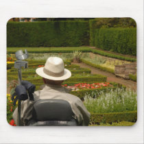 Disabled man in wheelchair in garden mousepads