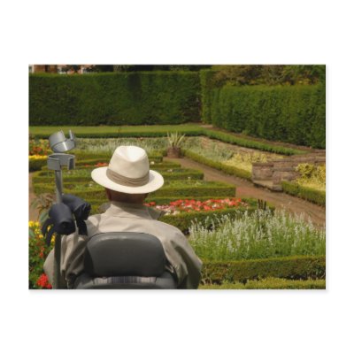 Disabled man in wheelchair in garden postcards by photoslot
