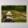 Disabled man in wheelchair in garden posters