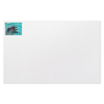 Dolphin head in aquamarine water stationery