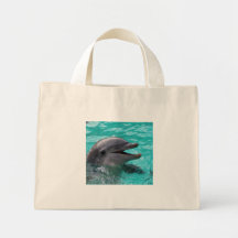 Dolphin head in aquamarine water tote bags
