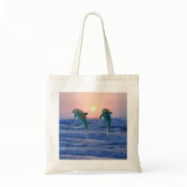 Dolphins at sunrise canvas bag