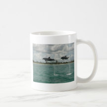 dolphins flying in the seas coffee mug