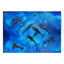 Dolphins swimming in the ocean greeting cards