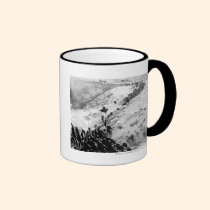 Driving cattle in the winter. mugs