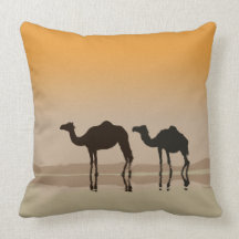 Dromedary camels and a mirage throw pillow