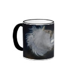 Droplet of water on a white feather mugs
