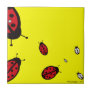 Eight Ladybugs on Yellow Tile