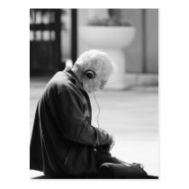 Elder man listen a music postcards