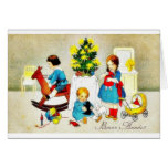 Enfants jouant avec les jouets et l'arbre de Noël Carte De Vœux