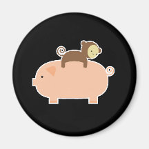 Équitation de singe de bébé sur un porc magnets