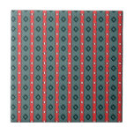 Ethnic ribbons and diamonds, red on dark cyan tiles