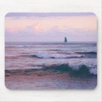 Evening waves with a green sail mousepads