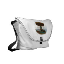 Fairgrounds Swings Stopped Against Grey sky Courier Bags