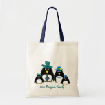 Famille de pingouin d'amusement.  Sac à provisions