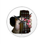 Female hand holding four string bass neck wall clocks