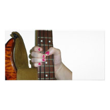 female hand holding four string bass neck photo cards