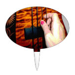 female hand pulling bass string 1 posterized cake picks