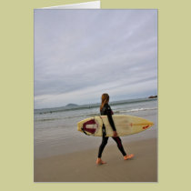 Female surfer on beach cards