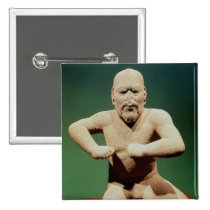 Figurine of a wrestler buttons