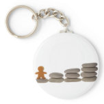 Figurine on stack of pebbles keychain