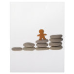 Figurine on stack of pebbles letterhead design