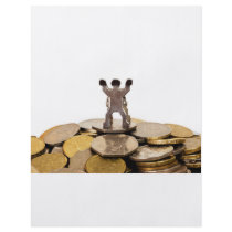 Figurine on top of a pile of coins flyers