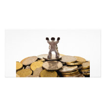 Figurine on top of a pile of coins personalized photo card