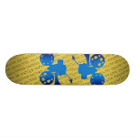 Film projector over yellow "movies" background skate decks