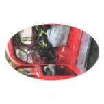 Fire Truck With Fireman's Uniform Oval Sticker