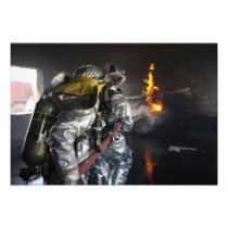 Firefighters extinguish a fire in a training ro