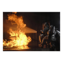 Firefighters extinguish a simulated battery fir photo