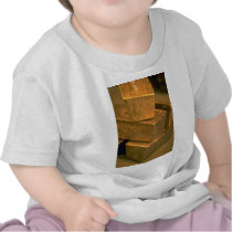Five 90 pound gold bricks tees
