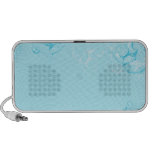 Floral design on bluish background laptop speakers