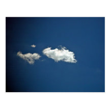 Fluffy white cloud on deep blue sky postcards