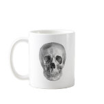 Frontal view drawing of a human skull coffee mug