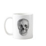 Frontal view drawing of a human skull coffee mug