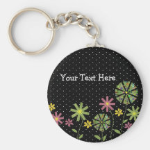Funky flower border on black background with white keychain
