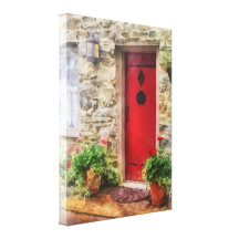 Géraniums par la porte rouge toile tendue sur châssis