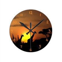 Giraffes At Sunset Wallclocks