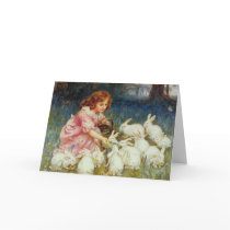 Girl feeding Rabbits Card