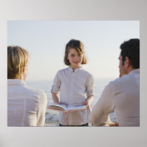 Girl reading a book in front of her parents poster