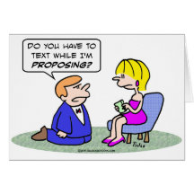 Girl texts while guy proposes. greeting card